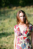 Young woman wearing summer dress, Old Danube, Vienna, Austria