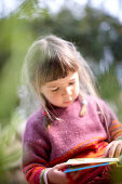 Girl with a book, Santanyi, Majorca, Balearic Islands, Spain