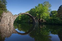 Rakotz bridge reflecting in lake Rakotzsee, Kromlau park, Kromlau, Saxony, Germany, Europe