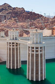 Hoover Dam and Lake Mead. Hydroelectric power generation.  Intake towers and dam wall. Electrcity cables and pylons., Hoover Dam and Lake Mead, USA