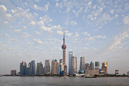 Skyline of Pudong at the Huangpu River under clouded sky, Pudong, Shanghai, China, Asia