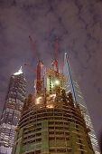 Construction site of Shanghai Tower next to Shanghai World Financial Center and Jin Mao Tower at night, Pudong, Shanghai, China, Asia