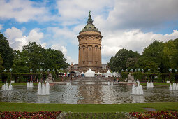 Fountains and water tower at the park, Mannheim, Baden-Wurttemberg, Germany, Europe