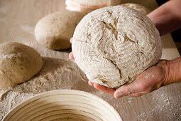 Person holding a loaf of bread, baking, homemade