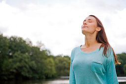 Pretty woman breathing in the park