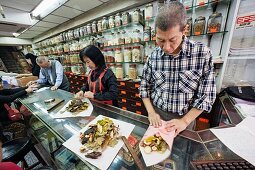 China,Hong Kong,Sheung Wan,Chinese Medicine Shop,Pharmacists Wrapping Chinese Herbal Medicine