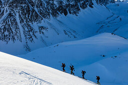 Backcountry skiers ascending to Schontalspitze, Stubai Alps, Tyrol, Austria