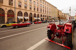 Red tractor, Fiat Dino Coupe and Ferrari in Maximilian street, Munich, Upper Bavaria, Bavaria, Germany
