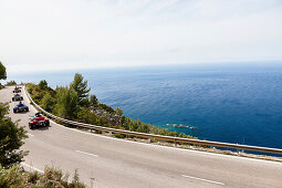 Trikes on winding coast road at Mediterranean Sea, Estellencs, Mallorca, Spain