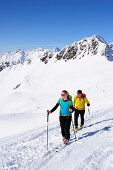 Two cross-country skiers ascending to mount Kreuzspitze, East Tyrol, Tyrol, Austria