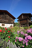 Garden and traditional wooden house, Valais, Switzerland