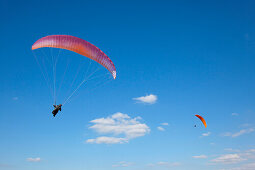 Paraglider in front of clouded sky, North Rhine-Westphalia, Germany