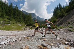 Trailrunning, Trail running, Trail, Ramsau, Dachstein, Styria, Austria, couple, woman, man, running, walking, run, mountains, brook, dog, water jogging, sport, fitness, health,. Trailrunning, Trail running, Trail, Ramsau, Dachstein, Styria, Austria, coupl