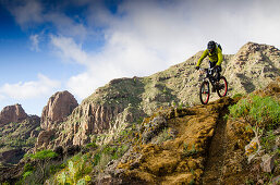 Downhill mountain biker on a mountain trail, Tenerife