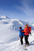 Two backcountry skiers ascending to Wildspitze, Oetztal Alps, Tyrol, Austria