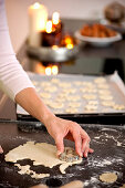 Mid adult woman baking cookies