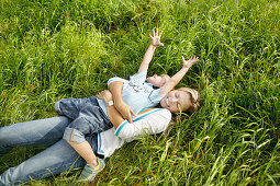 Mother and son  playing on grass, Vienna, Austria