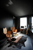 Man looking out of a window in a lounge of a hotel suite, Paris, France