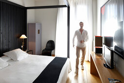 Man in a hotel room, Barcelona, Catalonia, Spain