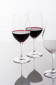 Two glasses of red wine and an empty glass, Hamburg, Northern Germany, Germany