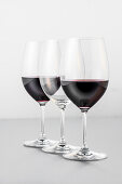 Two glasses of red wine and an empty glass, Hamburg, Northern Germany, Germany