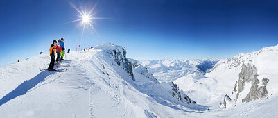 Three skiers at Schindlergrat, St. Anton, Tyrol, Austria