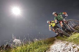 Two mountain bikers off roading, Eckbauer, Garmisch-Partenkirchen, Bavaria, Germany