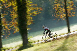 Man cyclocross touring in autumn, Degerndorf, Munsing, Bavaria, Germany