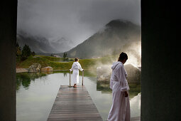 Hotel guests at a natural source pond, Tannheim, Tannheim Valley, Tyrol, Austria