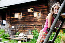 Girl on a ladder, Styria, Austria