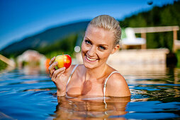 Young woman in a swimming pool of a hotel, Fladnitz an der Teichalm, Styria, Austria