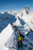 Skier ascending to Blanc de Moming, glacier Durand and Dent Blanche in background, Val d Anniviers, Canton of Valais, Switzerland