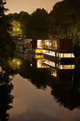 Houseboats on the Eilbek canal at night, Hamburg, Germany