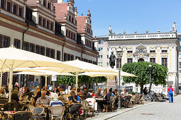 Pavement cafe, old stock exchange building in background, Leipzig, Saxony, Germany