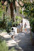 Woman at stairs to the Piazza, Aman Sveti Stefan, Sveti Stefan, Budva, Montenegro