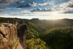 Young woman on Domerker looking at view, Saxon Switzerland National Park, Saxony, Germany