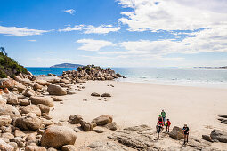 A group of people at the beach of Fairy Cove, Wilsons Promontory, Victoria, Australia
