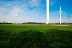 Wind turbines and electricity pylons, Dortmund, North Rhine-Westphalia, Germany