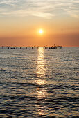 Pier at sunset, seaside resort of Kuehlungsborn at the Baltic Sea, Mecklenburg-Western Pomerania, Germany