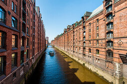 Excursion boat passing Speicherstadt, Hamburg, Germany