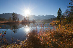 Sunrise, view over lake Barmsee to the Soiern mountains and Karwendel mountains, near Mittenwald, Bavaria, Germany