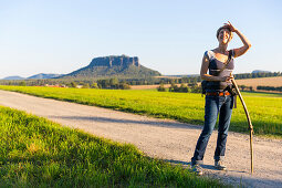 Woman hiking, Lilienstein in background, Weissig, Struppen, Saxon Switzerland, Saxony, Germany