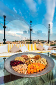 Nuts and dried fruit appetizer, rooftop restaurant with view over the city, Istanbul, Turkey