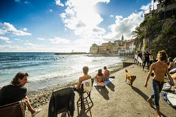 Seafront and surfer, Bogliasco, province of Genua, Italian Riviera, Liguria, Italy