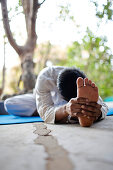 Man practicing yoga, Gokarna, Karnataka, India
