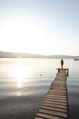 Woman on a hotel pier, Vourvourou, Sithonia, Chalkidiki, Greece