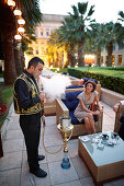 Man serving shisha in a hotel bar, Istanbul, Turkey