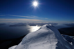 Two mountaineers on Monte Sarmiento, Strait of Magellan in background, Cordillera Darwin, Tierra del Fuego, Chile