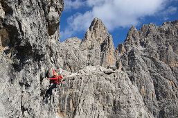 Climber ascending Detassis, Cima Brenta Alta, Dolomites, Trentino, Italy