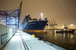 Docking maneuver of the CMA CGM Marco Polo in the Container Terminal Burchardkai in Hamburg, Germany
